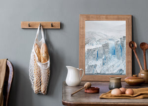 Vertical blue crevasses contrast with white and grey Antarctic ice.