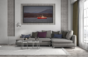 Old icebreaker against Martial mountains backdrop