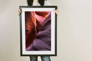 A winding Antelope Canyon opening between overlapping rock forms.