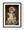 Antique porcelain doll wearing a lace bonnet and layered dress in warm sepia tones.