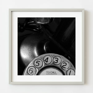 Black and white close-up of vintage rotary phone dial