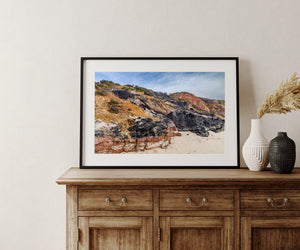 Rust red bands and dark clay layers shape the coastal cliffs at Aquinnah.