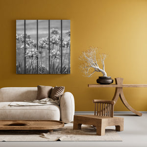 Tall flowers arranged behind simple vertical bars