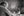 Monochrome photograph of elderly man dining alone