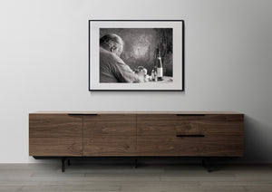 Restaurant table with sleeping diner and wine bottle