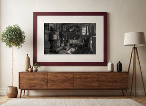 Sepia photograph of wooden walls, stove and everyday furnishings in an Arizona mining cabin.