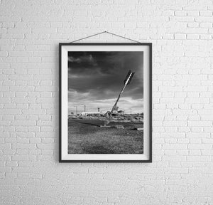 Broad metal fins and a long tilted shaft silhouette an Arizona roadside arrow.