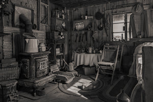 Historic mining cabin with wood stove and lanterns