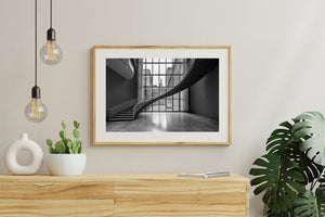 Fine railings contrast with the dark curve of a modern Chicago museum staircase.