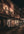 Amber light falls across shopfronts and pavement on a narrow Asakusa street at night.