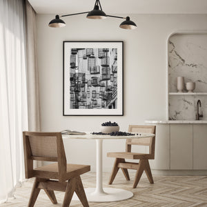 Geometric pattern of suspended metal birdcages in an urban setting