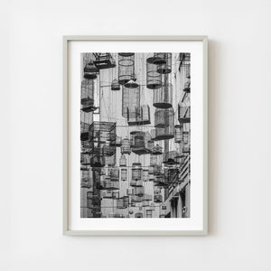 Hanging birdcages installation in Angel Place Sydney photographed in monochrome