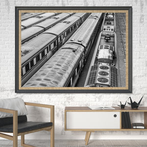 An elevated view turns train roofs and ventilation grilles into strong diagonal lines.