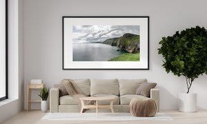 Colour landscape photograph of Ballintoy’s grass-topped cliffs and open Northern Ireland coastal water.