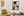 A pale blurred figure contrasts with sharp doorways, windows and stone blocks in the laneway.