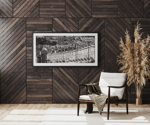 Modern interior with wooden wall paneling, a chair, and decorative plant.