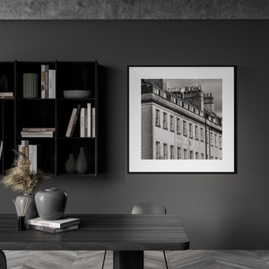Black and white architectural photograph of Bath upper floors, sash windows and chimney pots.