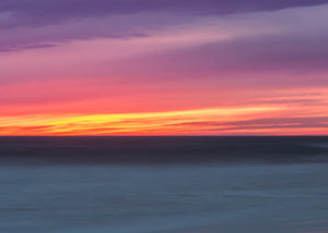 Pacific Ocean horizon beneath vibrant evening skies