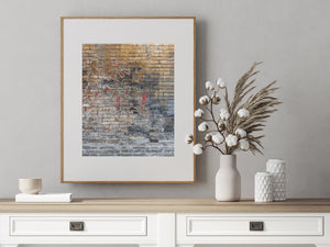 Close colour photograph of a Beijing brick wall with layered textures and faded writing.