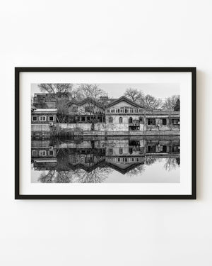 Buildings and bare trees reflect in the still water of Beijing’s Forbidden City moat.