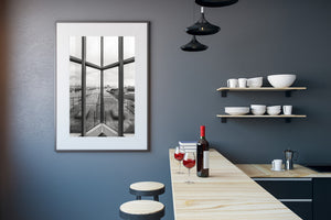 Black and white Belfast photograph combining window architecture and harbour scenery