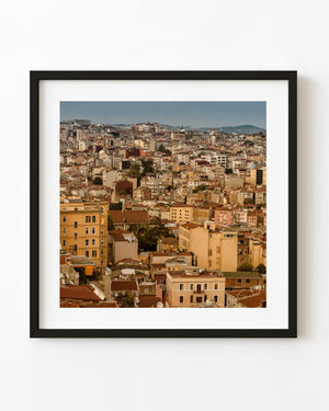 Beyoğlu apartment rooftops in warm light across Istanbul in colour
