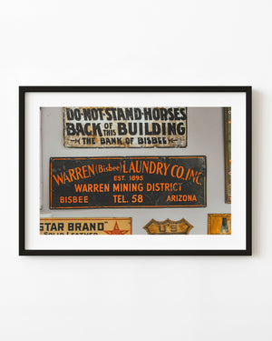 Vintage advertising signs with orange laundry lettering in Bisbee Arizona