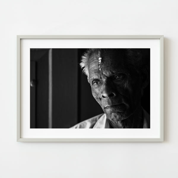 Elderly man in Kochi with contemplative gaze