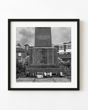 The Bloody Sunday Memorial in Derry with engraved names and tributes in black and white.