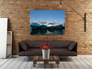 Australian maritime photograph of a fishing fleet under open blue sky.
