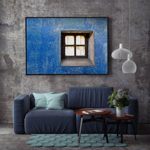 Weathered stone and blue wall contrast