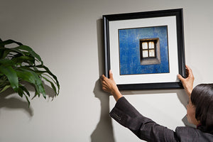 Faded blue paint on old prison wall