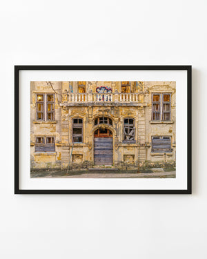 Boarded doors and faded yellow hotel facade in Croatia