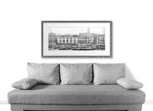 Boats and passenger vessels beneath historic Venetian facades