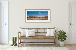 California ghost town landscape with low rooftops and bare hills