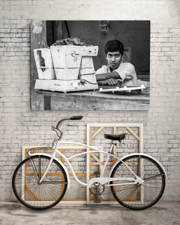 Industrial scene with young man and old machine – black and white