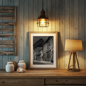 Quiet Brasov architecture with varied rooflines and wall-mounted street lamps