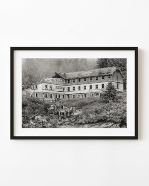 Abandoned timber building in coastal British Columbia, photographed in black and white.