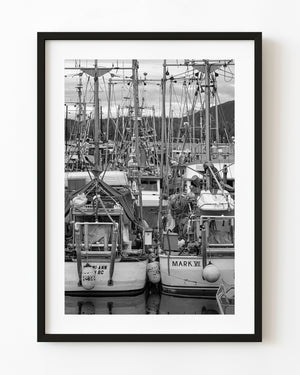 Fishing boats and dense rigging in British Columbia, photographed in black and white.