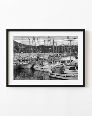 British Columbia fishing fleet in a harbour, photographed in black and white.