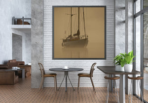 Gentle morning light cloaks a lone sailboat in a mystical mist, creating a tranquil scene on British Columbia's waterways.