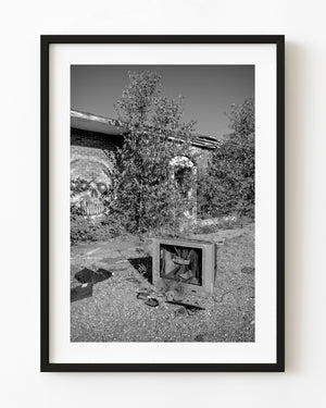 Broken television at an abandoned Ontario motel, photographed in black and white.
