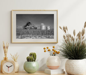 Rural landscape with old barn and silos