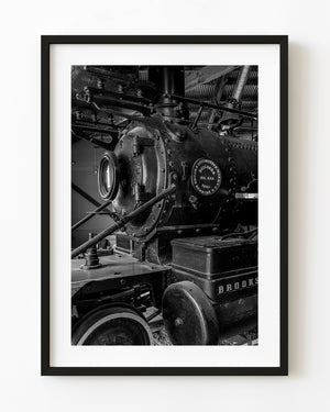 Brooks steam locomotive machinery in Dawson City, Yukon, photographed in black and white.