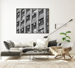 Monochrome Argentine architecture photograph with concrete panels and small window units.