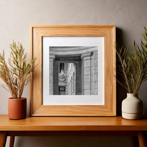 Black and white study of classical architectural forms and weathered stone surfaces.