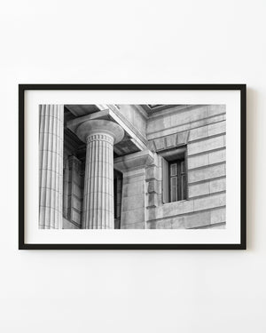 Black and white photograph of Buenos Aires fluted columns and a stone-framed window.