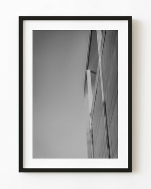 Black and white photograph of a modern building edge against the sky in Buenos Aires.
