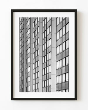 Black and white photograph of a repeating office-window grid in Buenos Aires.
