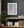 Geometric office-window pattern with alternating light panels and dark frames.